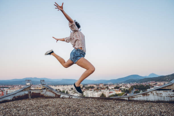 istock Woman jumps of joy 1063259858