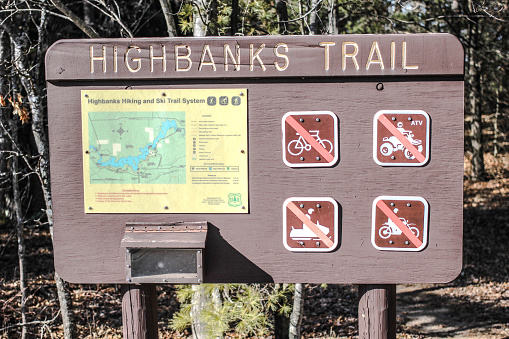 Oscoda, Michigan, USA - March 22, 2015: Sign for the trailhead of the Highbanks Trail in the Huron Manistee National Forest. The trail follows the banks of the legendary Au Sable River and offers sweeping views of the surrounding wilderness.