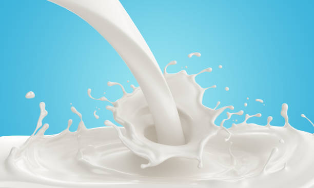 istock Pouring Milk splash or Yogurt isolated on blue background. 1063264438