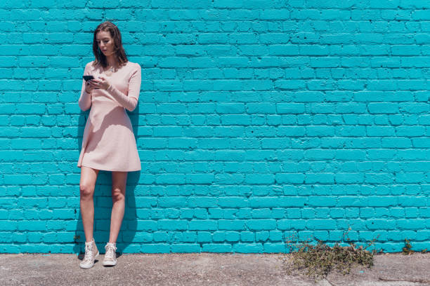 istock Millennial girl using smart phone. 1063268874