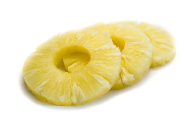 istock Slices of pineapple isolated on white background 1063270300