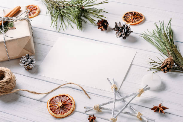 istock White blank sheet with a christmas composition. Flat lay, top view, copy space 1063270684