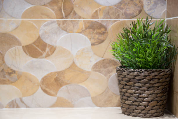 istock Green plastic tree placed in the bathroom. Brown tile background 1063277788