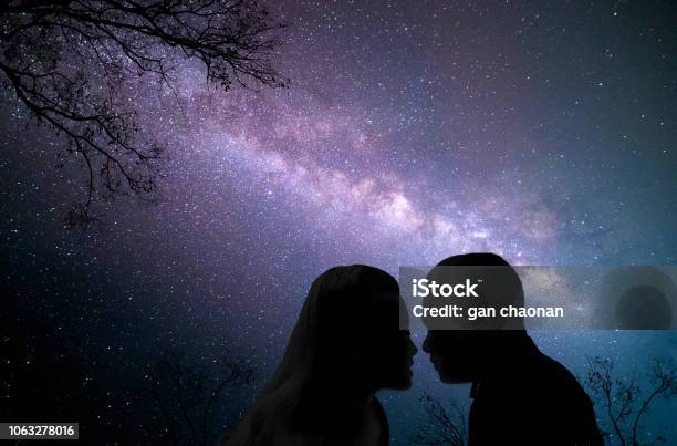 Couple Of Lovers Kissing Under The Milky Way Galaxy Background Valentines Day Concept Stock Photo - Download Image Now
