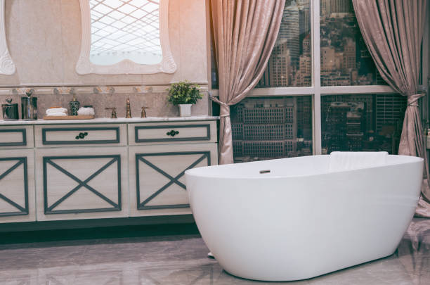 istock Beautiful luxury vintage empty bathtub  Freestanding white bath. bathroom is beautifully. 1063278050