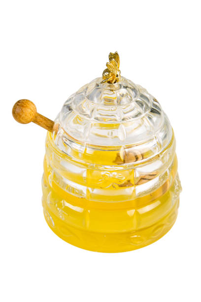 istock Luxury Honey pot with honey comb cut out on a white background 1063280662