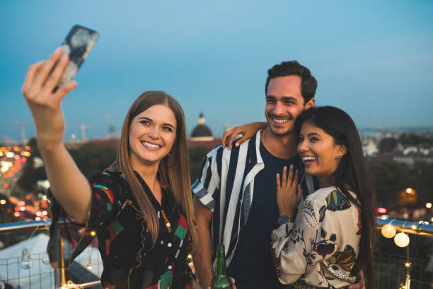 istock Friends making a selfie at rooftop party 1063282212