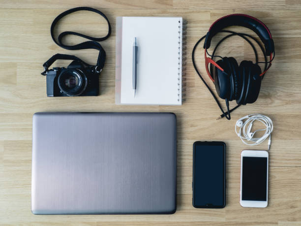 istock top view of work space concept with notebook, smartphone, laptop and gadget on white background with copy space, graphic designer, Creative Designer concept. 1063288202