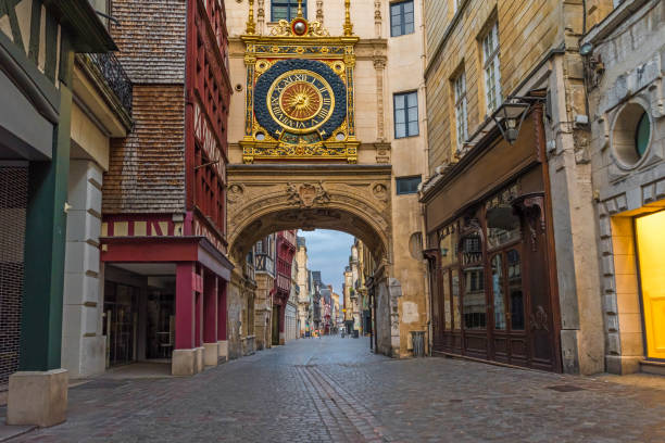 old cozy street in Rouen with famous Great clocks or Gros Horloge of Rouen, Normandy, France old cozy street in Rouen with famous Great clocks or Gros Horloge of Rouen, Normandy, France with nobody rue du gros horloge photos stock pictures, royalty-free photos & images