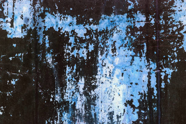 istock Old concrete wall stained with blue paint. Design texture for house interior or wallpapers. 1063289546