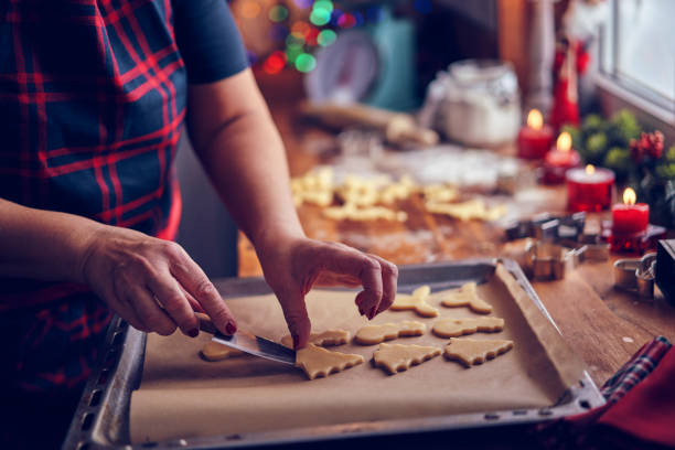 istock Preparing Christmas Cookies in Domestic Kitchen for Holidays 1063291988