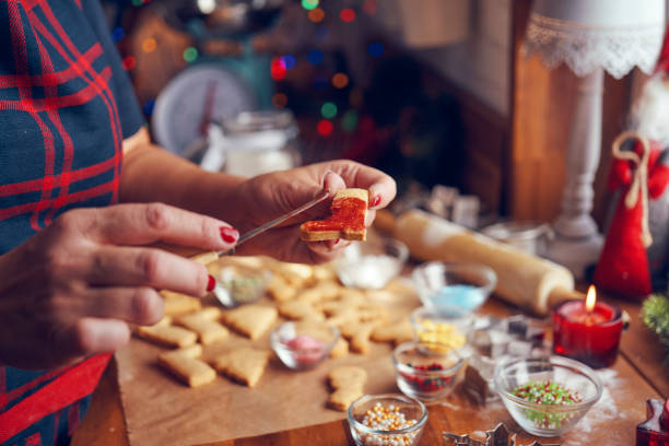 istock Decorating Christmas Cookies with Icing and Sugar Pearls 1063292282