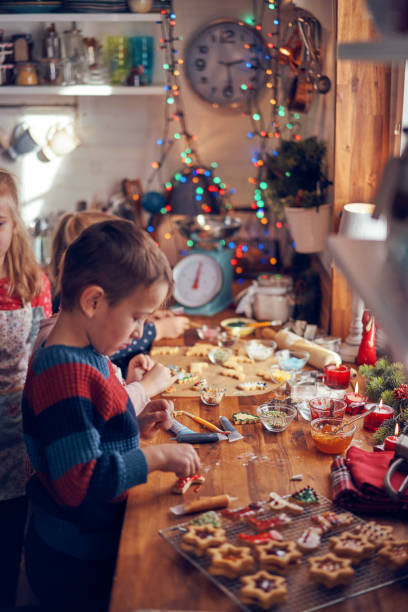 istock Decorating Christmas Cookies with Icing and Sugar Pearls 1063292328