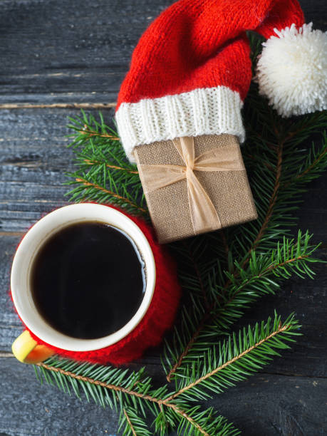 istock Coffee mug and Christmas gift in the hat 1063293662