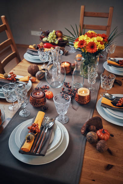 istock Decorated Table for Thanksgiving Dinner with Candles, Pumpkins, Leafs and Nuts 1063298656