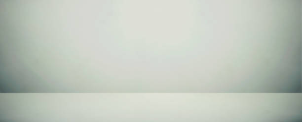 istock white and gray room studio banner and blank and empty background 1063299794
