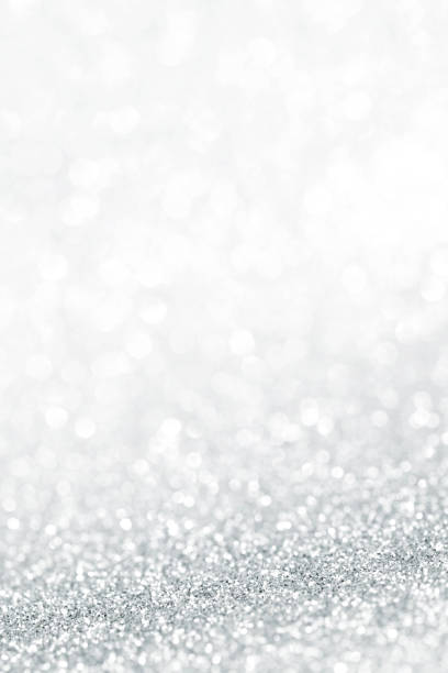 istock Silver festive glitter background with defocused lights 1063301764
