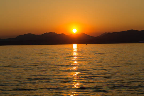 istock Beautiful sunset at Garda lake in Italy 1063303638