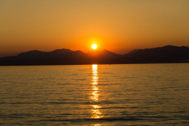 istock Beautiful sunset at Garda lake in Italy 1063303654