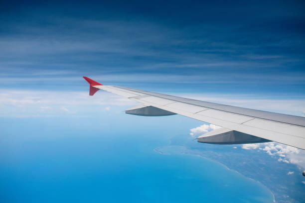 Airplane flight high above the clouds over Malaysia.