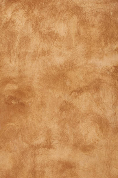 istock Grunge beige brown painted plaster wall background 1063304348