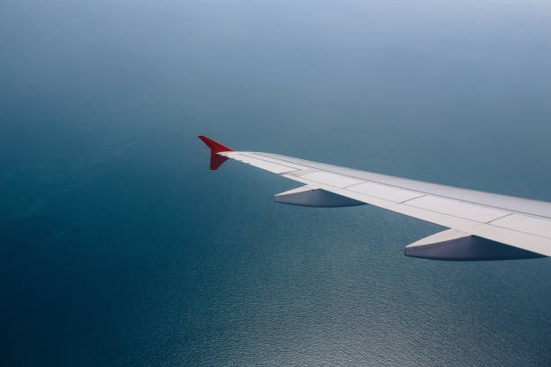 istock Airplane flying over the Southeast Asia sea 1063308104