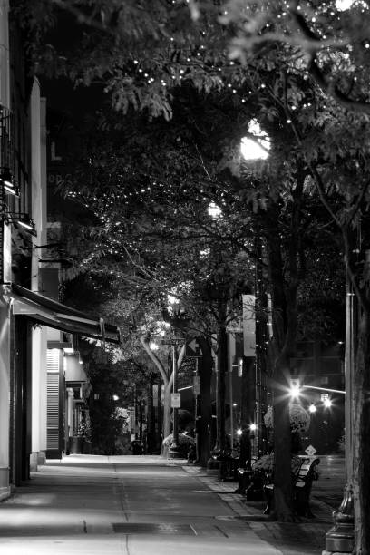 istock Night street scene with sidewalk 1063308616
