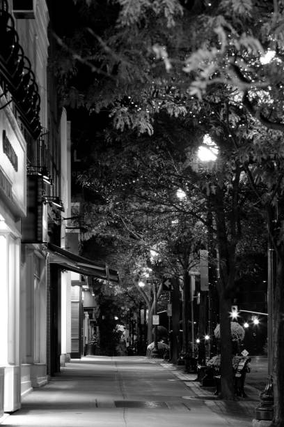istock Night street scene with sidewalk 1063308646