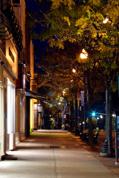 istock Night street scene with sidewalk 1063308656
