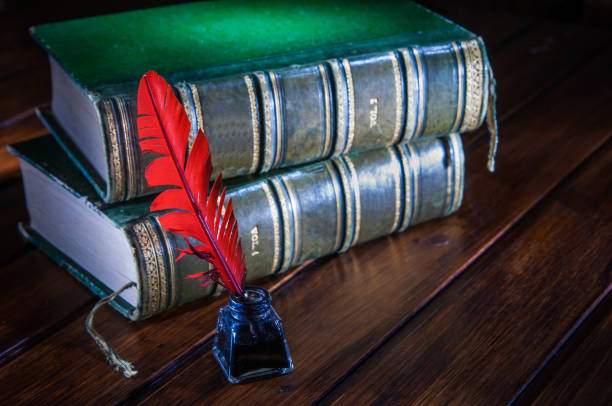 istock Quill pen and old books 1063309056