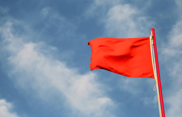 istock red flag used to indicate the rough sea 1063312296