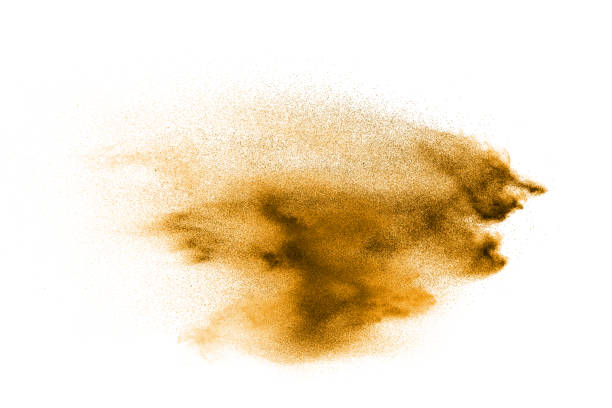 istock Dry river sand explosion. Golden colored sand splash against white background. 1063320436