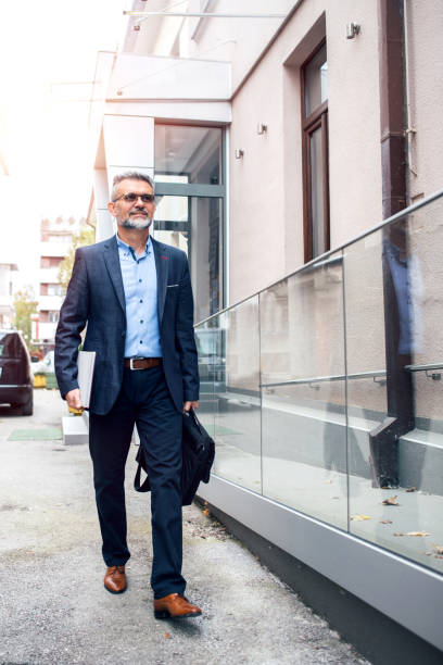 istock Businessman walking in the city 1063320550