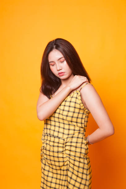 istock Young Asian woman got back pain. 1063325552