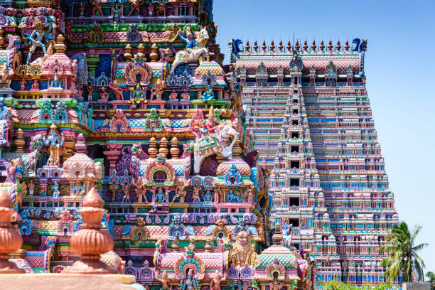 Gopurams in Sri Ranganathaswamy Temple, India A Gopuram is a monumental gatehouse tower, usually ornate, at the entrance of a Hindu temple usually found in the southern India tamil nadu stock pictures, royalty-free photos & images