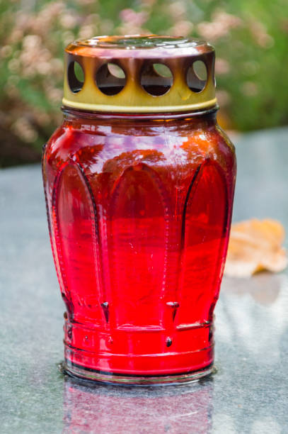 istock Burnt out red grave candle after All Saints' Day. 1063329302