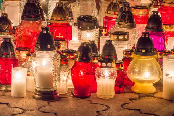 istock Burning grave candles in the cemetery at night. 1063329644