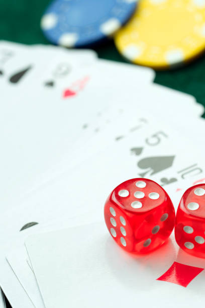 istock Red Dices Money Chips and Gambling Cards 1063330272