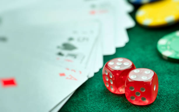 istock Red Dices Money Chips and Gambling Cards 1063332404