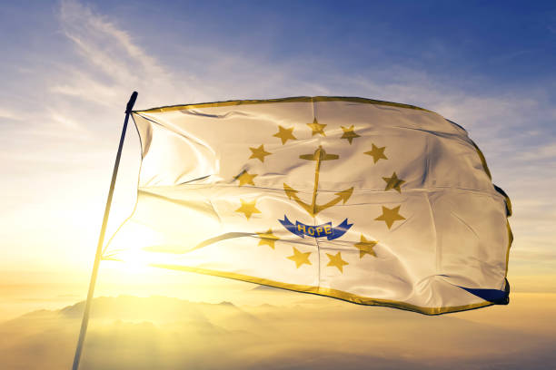 Rhode Island state of United States flag textile cloth fabric waving on the top sunrise mist fog Rhode Island state of United States flag on flagpole textile cloth fabric waving on the top sunrise mist fog rhode island photos stock pictures, royalty-free photos & images