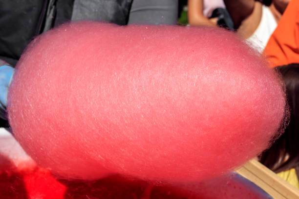 istock Cooking cotton candy on the street. Close-up 1063335554