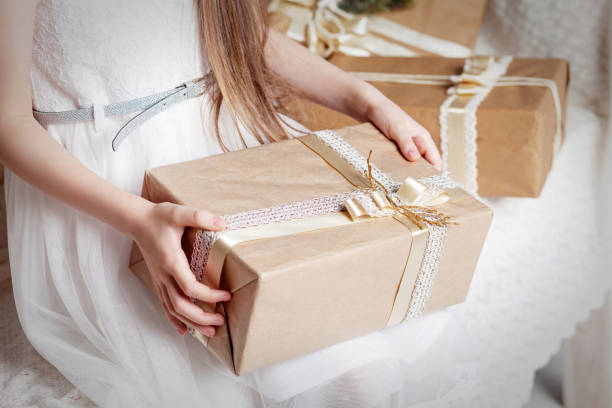 istock Girl's hands holding gift box. Copy space. Christmas, hew year, birthday concept. 1063340184