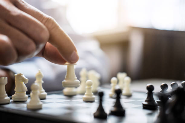 istock Hands of confident businessman colleagues playing chess game to development analysis new strategy plan, leader and teamwork concept for win and success 1063342230