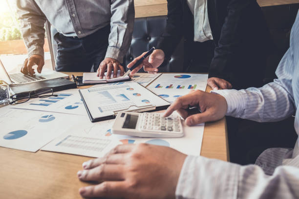 istock Meeting and greeting, Business team colleagues discussing working analysis with financial data and marketing growth report graph in team, Meeting Talking Brainstorming Communication Concept 1063343022