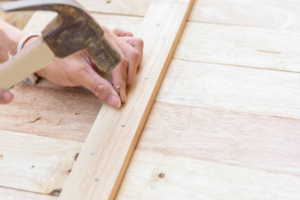 istock Worker hammer the nail into the wood 1063346648