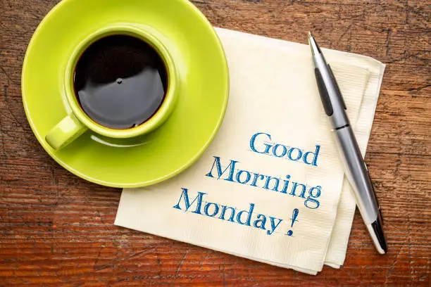 Good Morning Monday - handwriting on a napkin with a cup of coffee