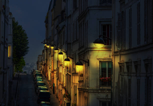 istock Narrow street  in Paris by night 1063356308