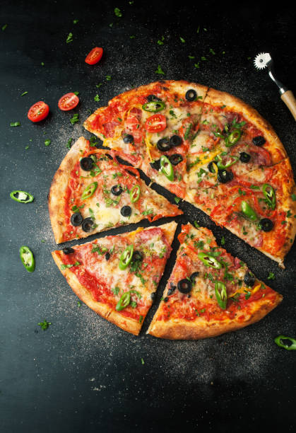 istock Delicious pepperoni pizza with fresh ingredients with chili pepper 1063357094