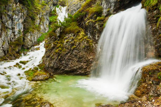 istock Alpine stream with waterfall in the Adamello Brenta natural park 1063360870