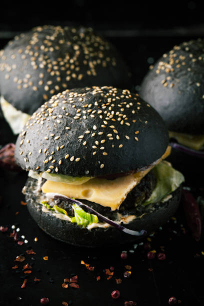 istock Delicious black burger with spices 1063360936